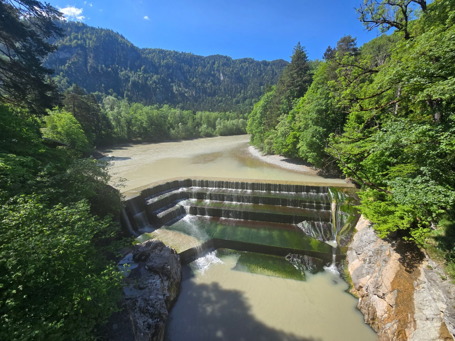 The Lechfall near Füssen: the river Lech pouring over stepped concrete weirs into a rocky gorge