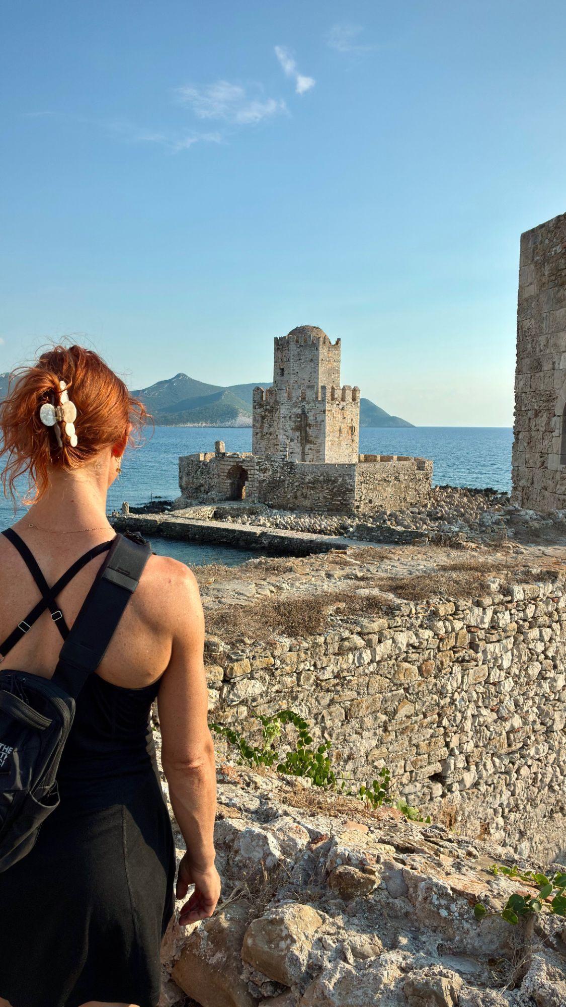 Kristine looking out at the Bourtzi tower from the walls of Methoni Castle