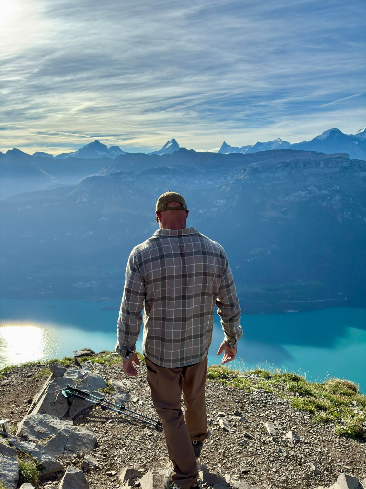 Standing on the summit looking out over turquoise Lake Brienz towards the snow-capped Bernese Alps