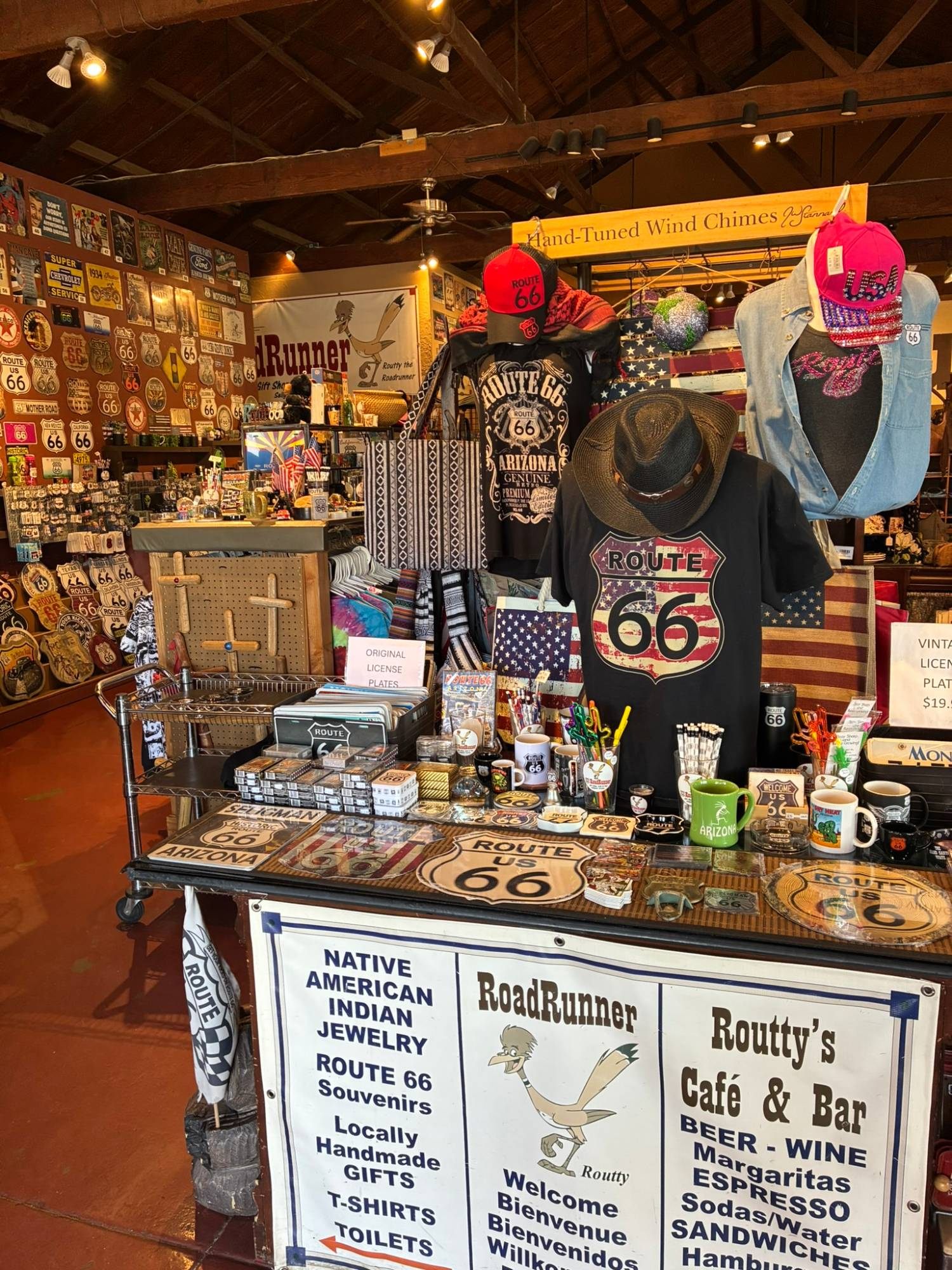 Souvenir table in the RoadRunner gift shop covered in Route 66 mugs, plates and T-shirts