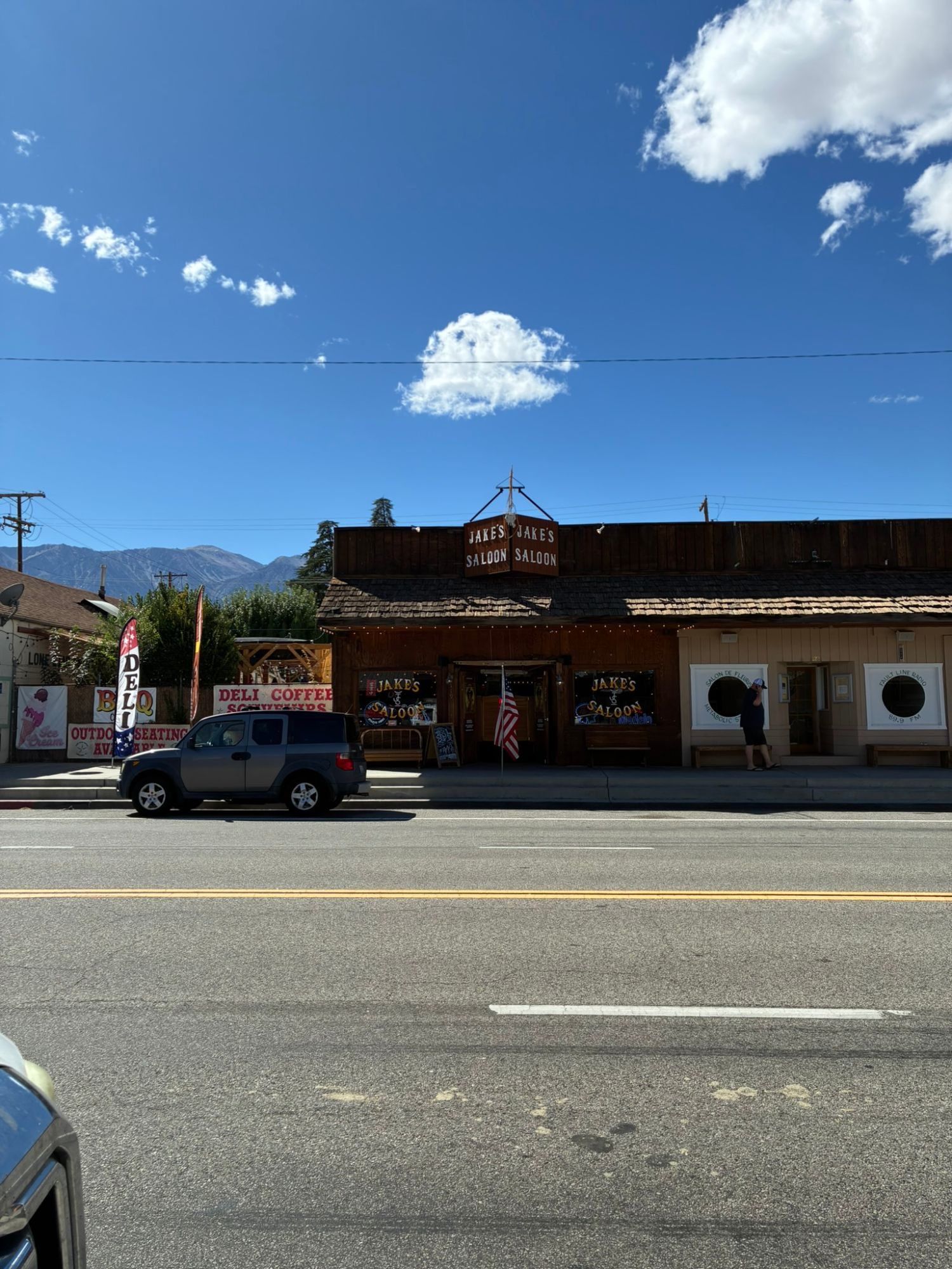 Jakes Saloon and western-style storefronts on the main street of Lone Pine, with mountains behind