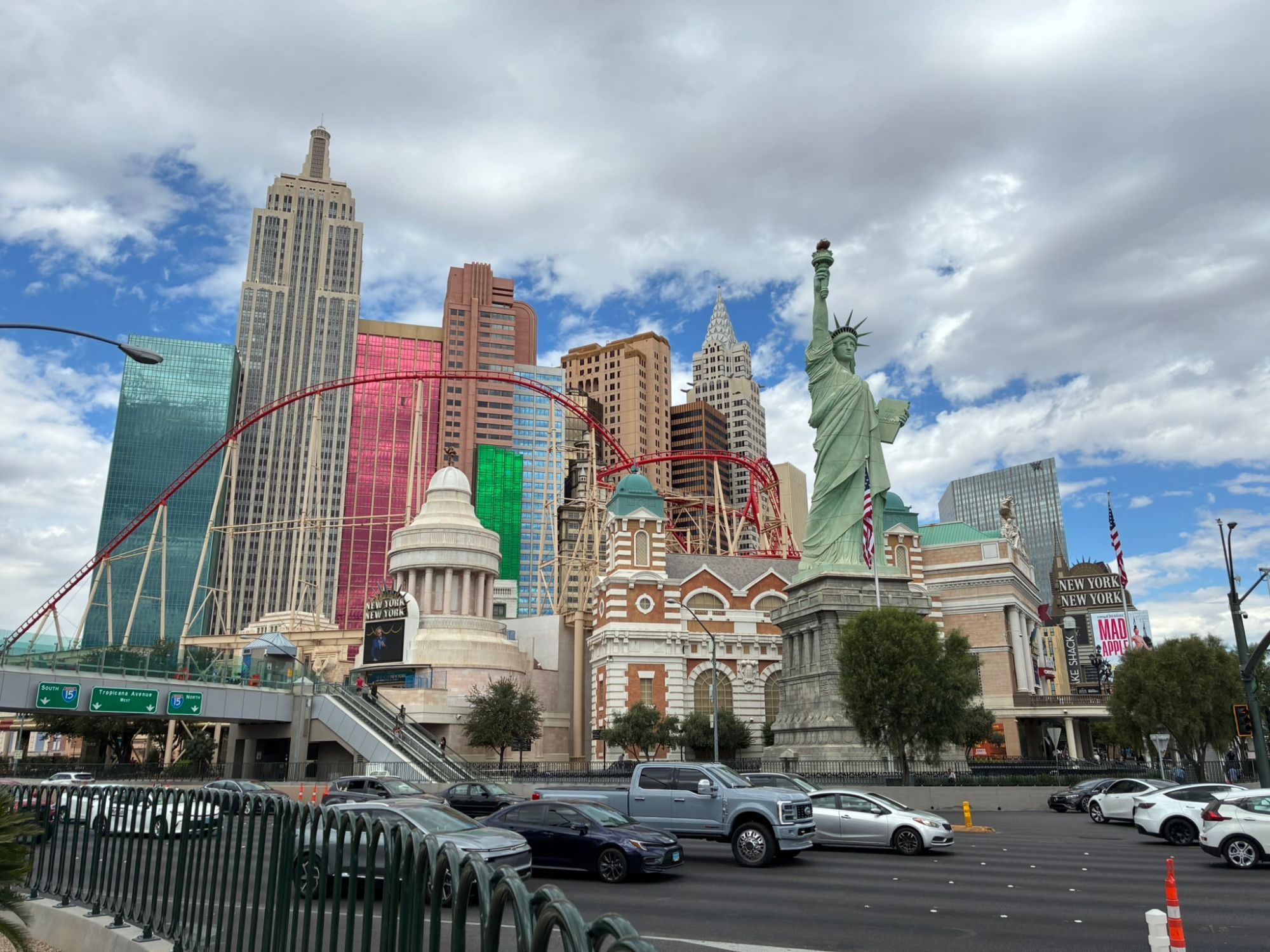New York-New York hotel on the Strip with its replica Statue of Liberty, skyline towers and red roller coaster