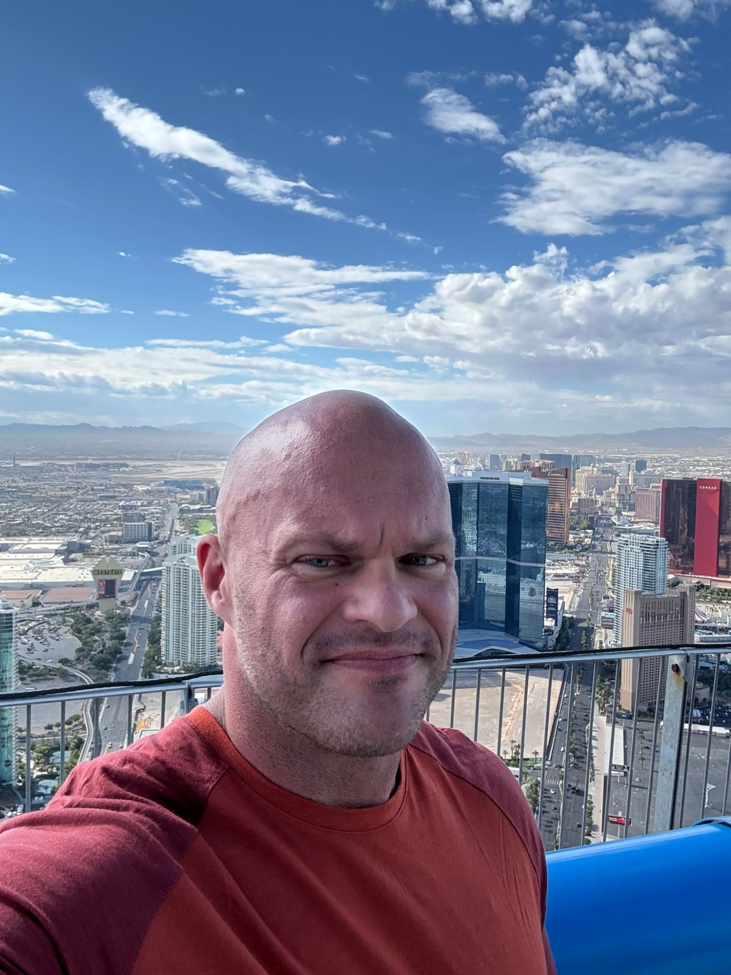 Selfie of Leif on The STRAT with the Las Vegas skyline, the Fontainebleau and desert mountains far below